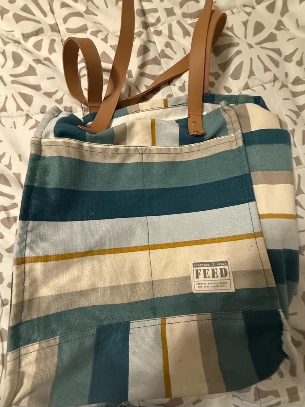 FEED striped tote bag purse. Lots of pockets and long straps.